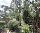 Gartenansicht von Terrasse - Seltene Gelegenheit in Seeheim: Potenzialstarke Doppelhaushälfte auf sonnigem Traumgrundstück