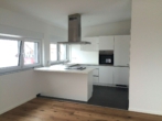 Küche - Exklusives Penthouse-Wohnen in Karlsdorf: Fernsicht & Top-Energiewerte