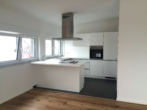 Küche - Exklusives Penthouse-Wohnen in Karlsdorf: Fernsicht & Top-Energiewerte